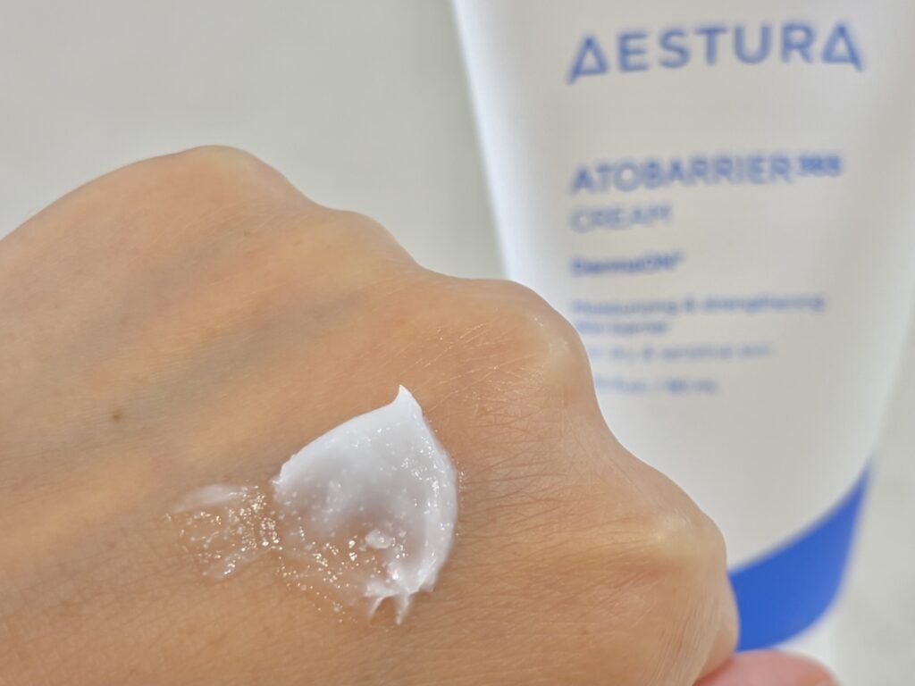 Close up texture of Aestura Atobarrier 365 Cream showing visible melting DermaON ceramide capsules.