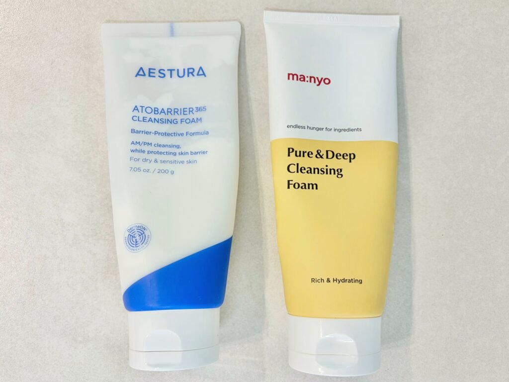 Aestura Atobarrier 365 and Manyo Factory foams placed side by side, comparing low-pH vs alkaline cleansers.