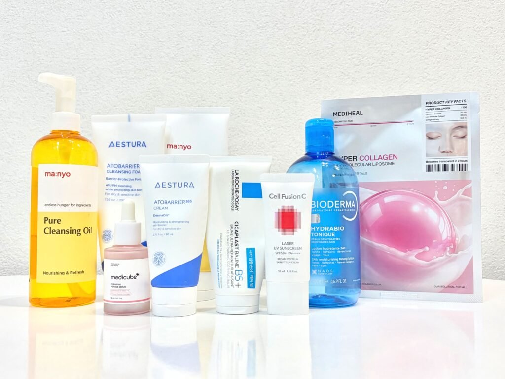 Complete autumn skin barrier reset routine flat lay featuring Manyo, Aestura, and Medicube for the Korean moisture sandwich method.