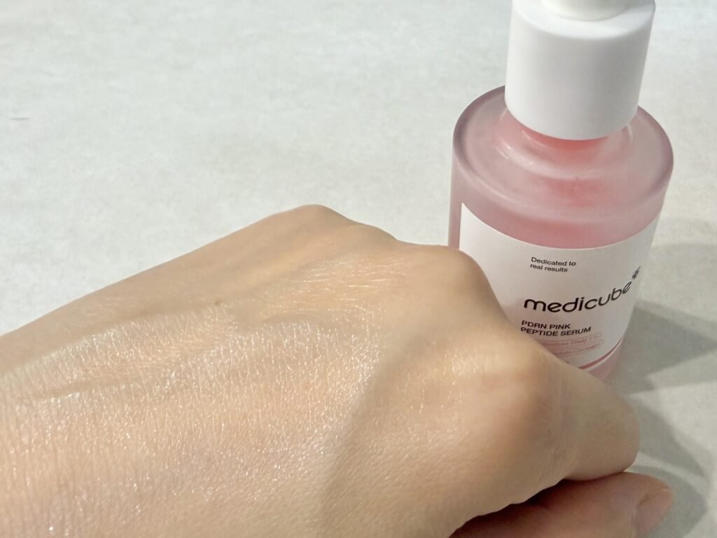 Fully absorbed Medicube PDRN ampoule showing radiant dewy finish without sticky residue