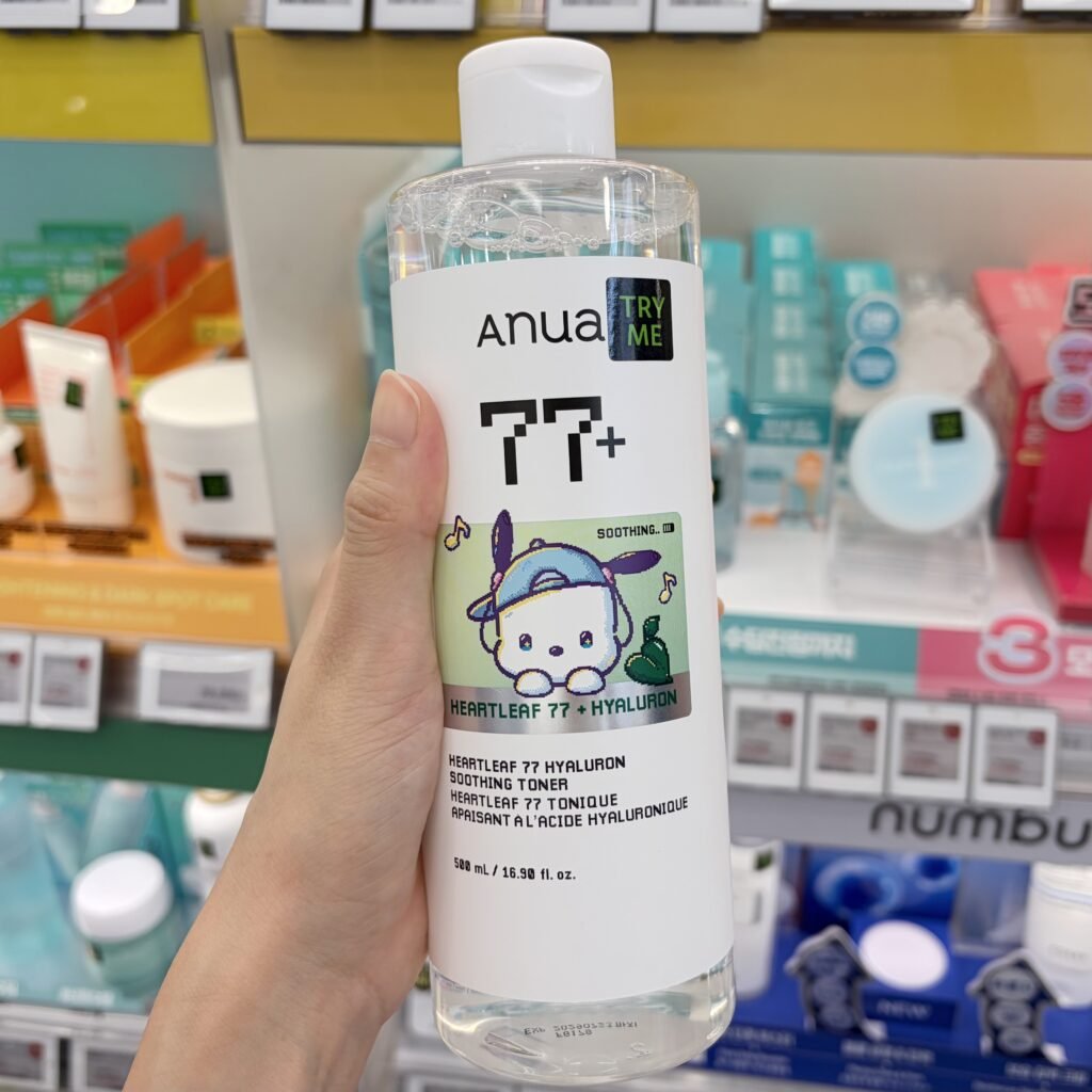Anua Heartleaf 77% Soothing Toner bottle held in hand during an in-store Seoul Olive Young vanity check, featuring the special Sanrio Pochacco collaboration design.