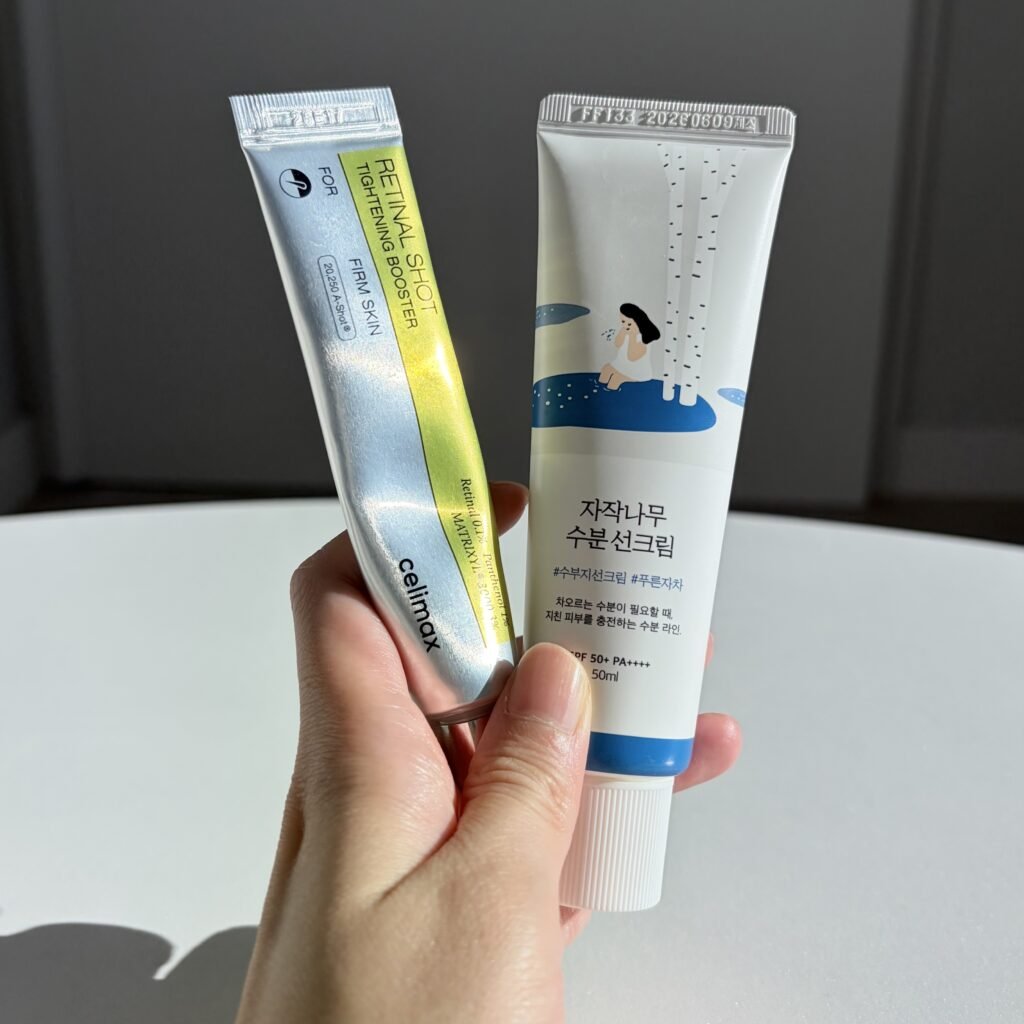 Celimax Retinal Shot booster paired with Round Lab Birch Juice Moisturizing Sunscreen for morning protection