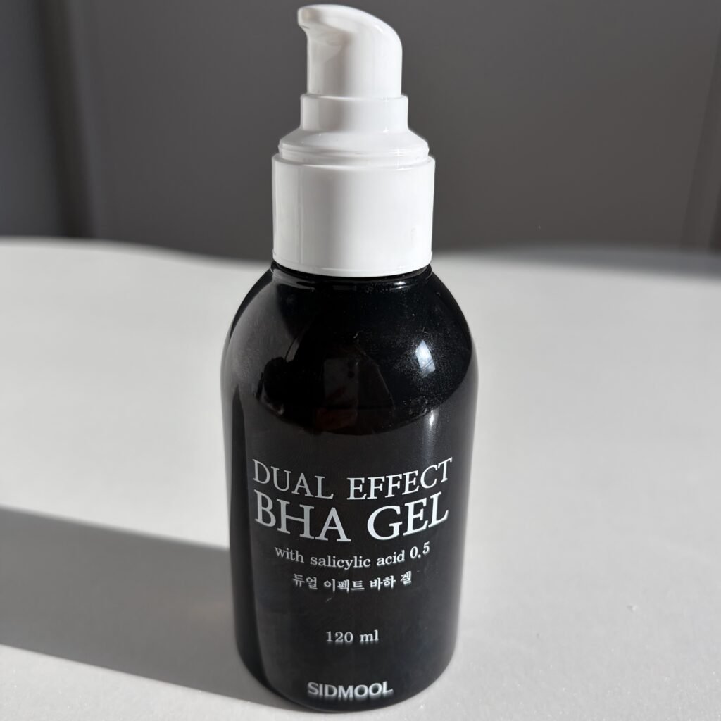 Front view of Sidmool Dr. Troub Dual Effect BHA Gel tube on a minimalist bathroom vanity